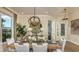 Elegant dining room featuring modern chandelier and stylish decor at 5259 Quillback Ln, St Cloud, FL 34771