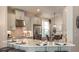 Gourmet kitchen with stainless steel appliances and counter seating at 5259 Quillback Ln, St Cloud, FL 34771