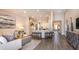 Inviting living space with open kitchen, dining area, and stylish decor at 5259 Quillback Ln, St Cloud, FL 34771