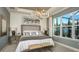 Luxurious primary bedroom features a large window and elegant furnishings at 5259 Quillback Ln, St Cloud, FL 34771