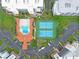 Overhead view of complex pool and tennis courts at 5300 S Atlantic Ave # 6-301, New Smyrna Beach, FL 32169