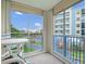 This condo balcony offers views of the neighborhood from its seating area and large sliding glass windows at 5300 S Atlantic Ave # 6-301, New Smyrna Beach, FL 32169