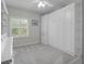 Neutral bedroom featuring built-in closet, carpet and a ceiling fan at 5300 S Atlantic Ave # 6-301, New Smyrna Beach, FL 32169