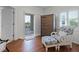 Bedroom featuring hardwood floors and balcony access at 5300 S Atlantic Ave # 6-301, New Smyrna Beach, FL 32169