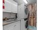 Laundry Room featuring washer and dryer stacked on top of each other at 5300 S Atlantic Ave # 6-301, New Smyrna Beach, FL 32169