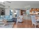 Inviting living room open to the dining and kitchen areas features hardwood floors at 5300 S Atlantic Ave # 6-301, New Smyrna Beach, FL 32169