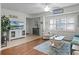 The living room features plantation shutters, stylish furnishings, and tile floors at 5300 S Atlantic Ave # 6-301, New Smyrna Beach, FL 32169