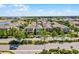 Aerial view of a neighborhood featuring sidewalks and well-maintained landscaping, close to amenities and shopping centers at 5711 Hamlin Groves Trl, Winter Garden, FL 34787
