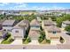 Aerial view of neighborhood homes with well-maintained landscaping and attached garages at 5711 Hamlin Groves Trl, Winter Garden, FL 34787