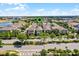 Aerial view of a neighborhood featuring sidewalks and well-maintained landscaping, close to amenities and shopping centers at 5711 Hamlin Groves Trl, Winter Garden, FL 34787