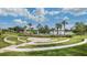 Outdoor community amphitheater featuring tiered seating and a beautiful lake view provides a serene gathering space at 5711 Hamlin Groves Trl, Winter Garden, FL 34787