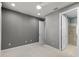 Spacious bedroom with ensuite bathroom featuring a tiled shower and glass door at 5711 Hamlin Groves Trl, Winter Garden, FL 34787