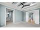 This bedroom boasts double doors to the bathroom and hallway, offering a flexible layout at 5711 Hamlin Groves Trl, Winter Garden, FL 34787