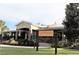 Exterior shot of the Overlook & The Cove Clubhouse Hamlin, showcasing its charming facade at 5711 Hamlin Groves Trl, Winter Garden, FL 34787