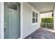 Inviting entryway features a neutral color palette and classic brick-paver flooring at 5711 Hamlin Groves Trl, Winter Garden, FL 34787