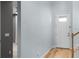 Bright entryway with wood floors and a staircase leading to the upper level at 5711 Hamlin Groves Trl, Winter Garden, FL 34787