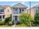 Charming two-story home with a covered porch and manicured landscaping at 5711 Hamlin Groves Trl, Winter Garden, FL 34787