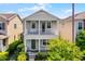 Charming two-story home with a covered porch and manicured landscaping at 5711 Hamlin Groves Trl, Winter Garden, FL 34787