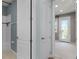 This hallway leads to a bathroom and another room, offering both functionality and an open, connected living space at 5711 Hamlin Groves Trl, Winter Garden, FL 34787