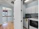 Convenient laundry room featuring new washer and dryer with plenty of storage at 5711 Hamlin Groves Trl, Winter Garden, FL 34787