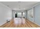 Bright living room with wood floors, board and batten wall and access to the backyard at 5711 Hamlin Groves Trl, Winter Garden, FL 34787