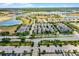 Aerial view of a well-maintained suburban neighborhood with tree-lined streets and beautiful homes in a Gathering-friendly community at 5711 Hamlin Groves Trl, Winter Garden, FL 34787