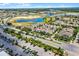 Aerial view of a well-maintained suburban neighborhood with tree-lined streets and beautiful homes in a Gathering-friendly community at 5711 Hamlin Groves Trl, Winter Garden, FL 34787