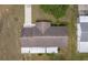 Birds eye view of roof, mature trees, and green grass at 6366 Sw 115Th Street Rd, Ocala, FL 34476
