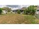 The backyard view includes a screened porch, established landscaping, and chain-link fencing at 6366 Sw 115Th Street Rd, Ocala, FL 34476