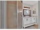 Bathroom featuring double sink vanity and enclosed shower at 6366 Sw 115Th Street Rd, Ocala, FL 34476