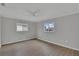 Bedroom featuring ceiling fan, windows, and hardwood floors at 6366 Sw 115Th Street Rd, Ocala, FL 34476