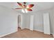 Bright bedroom featuring wood-look floors, ceiling fan, and neutral paint at 6366 Sw 115Th Street Rd, Ocala, FL 34476