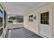 Covered porch with views of the front yard and house across the street at 6366 Sw 115Th Street Rd, Ocala, FL 34476