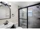Stylish bathroom features a walk-in shower with stone tile and sleek fixtures at 720 N 6Th St, Haines City, FL 33844