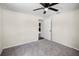 A bedroom featuring neutral walls, carpet flooring, and a ceiling fan at 720 N 6Th St, Haines City, FL 33844
