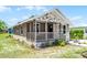 Inviting single-story home with stone accents, cozy porch, and well-kept lawn, perfect for a starter home at 720 N 6Th St, Haines City, FL 33844