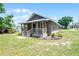 Charming home with a covered porch and well-manicured lawn at 720 N 6Th St, Haines City, FL 33844