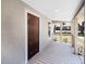 Covered porch showing the front door entrance and providing a shaded outdoor seating area with an open view at 720 N 6Th St, Haines City, FL 33844