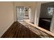 Bedroom with sliding glass doors to outdoor patio and light laminate flooring at 7314 Seena Ct, Orlando, FL 32835