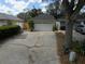 Attached one car garage with long driveway and mature tree at 7314 Seena Ct, Orlando, FL 32835