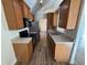 Kitchen with stainless steel appliances, wood cabinets, and modern countertops at 7314 Seena Ct, Orlando, FL 32835