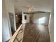 Open concept living room with new floors, ceiling fan, and natural light at 7314 Seena Ct, Orlando, FL 32835