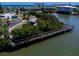 Overhead perspective of a charming wooden pier, playground, and gazebo, enhancing the community's recreational offerings at 865 Ladyfish Ave # C104, New Smyrna Beach, FL 32169