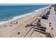 Scenic aerial view of a beautiful beach with easy access and parking, promising endless days of sun and surf at 865 Ladyfish Ave # C104, New Smyrna Beach, FL 32169