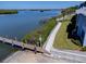 A practical boat ramp leading to scenic waters, with surrounding greenery and a walkway at 865 Ladyfish Ave # C104, New Smyrna Beach, FL 32169