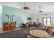 A clubhouse interior featuring a bar area, seating, and stylish decor, perfect for community gatherings at 865 Ladyfish Ave # C104, New Smyrna Beach, FL 32169