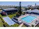 Aerial view of the pool, clubhouse, shuffleboard, and other amenities in this beachside community at 865 Ladyfish Ave # C104, New Smyrna Beach, FL 32169