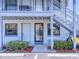 Home entrance featuring lush greenery and well-lit walkway at 865 Ladyfish Ave # C104, New Smyrna Beach, FL 32169