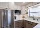 A close-up of the modern kitchen and its stainless-steel appliances at 865 Ladyfish Ave # C104, New Smyrna Beach, FL 32169