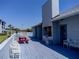 A comfortable patio with outdoor cooking grill and seating, perfect for barbecues and socializing at 865 Ladyfish Ave # C104, New Smyrna Beach, FL 32169